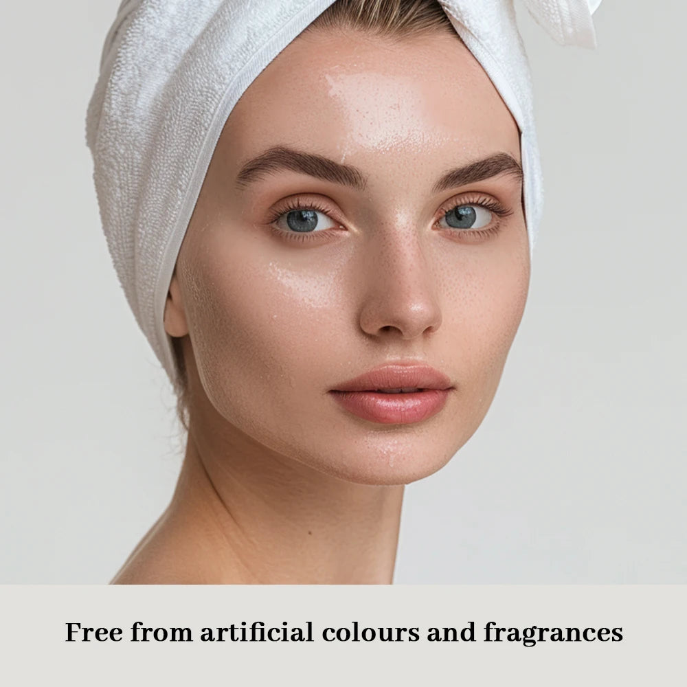 Woman with a towel on her head against a plain background, with text about artificial colors and fragrances.